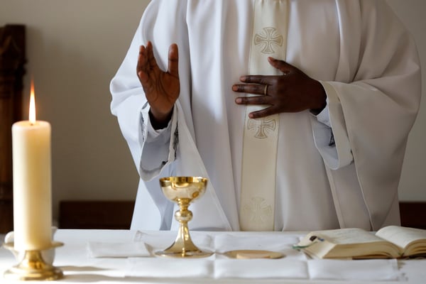 priest offering catholic mass intentions
