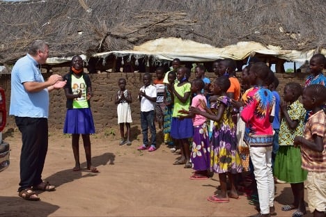 missionary talking to refugees