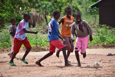 refugee boys playing soccer